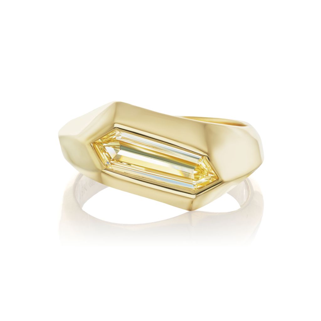 The Chunky Hexagonal Ring in Yellow Gold with Fancy Light Yellow Diamond showcases a large, elongated hexagonal yellow diamond set in an 18K yellow gold sculpted band, photographed on a white background.