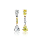 The This & That Champagne Flute Drop Earrings feature three mixed-shape diamonds each—one earring with all white stones, the other with a fancy yellow diamond framed by two whites, set in 18K yellow gold and white metal.