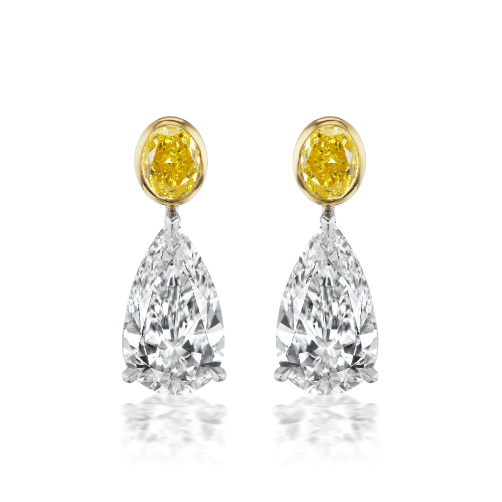 The Yellow Diamond & Diamond Moon Drop Earrings feature 18K gold, round yellow gemstones set in gold, and large, pear-shaped clear diamonds that dangle below in an elegant, symmetrical design.