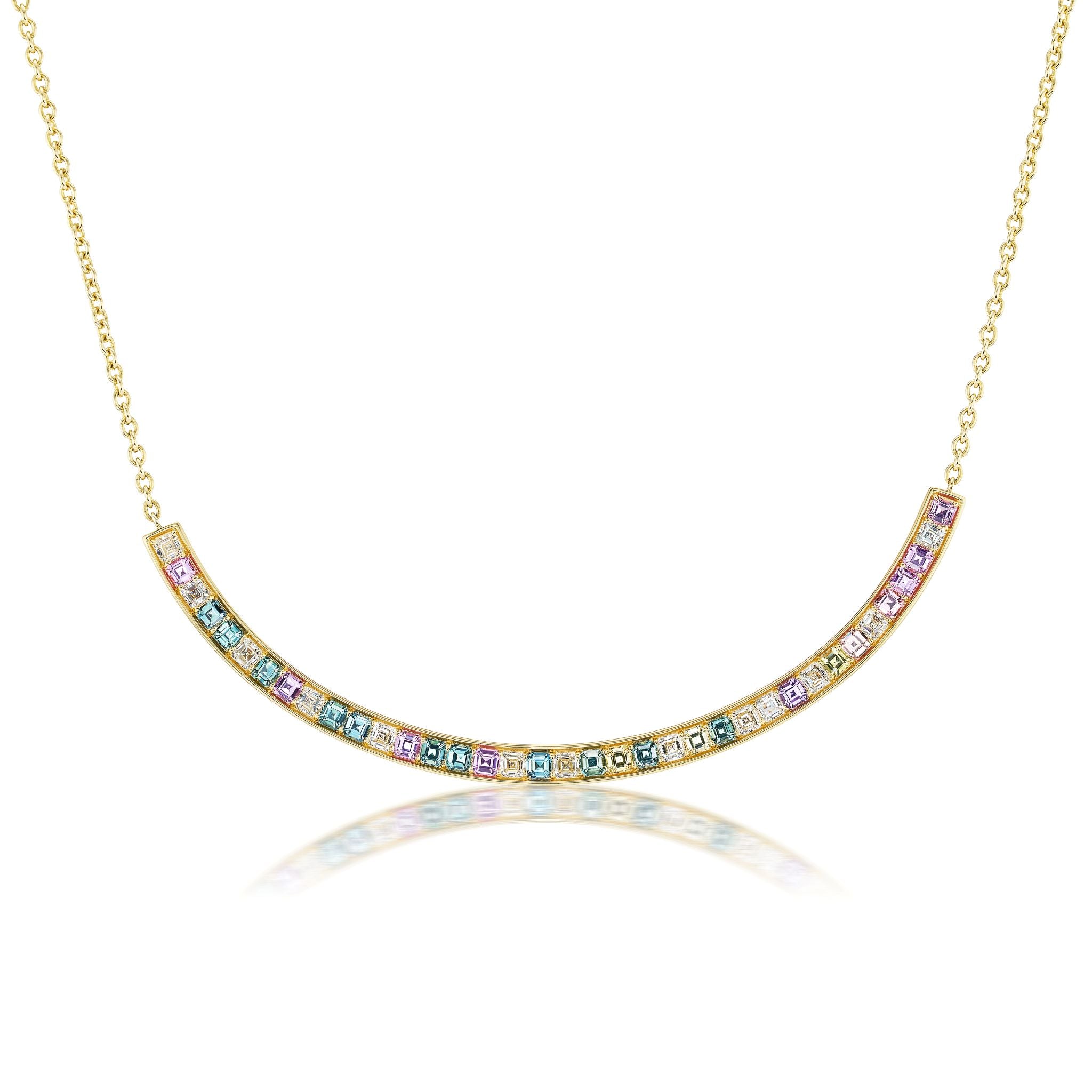 The Ombré Smile Bar Necklace in Yellow Gold features Asscher cut diamonds and multicolor sapphires in pink, blue, green, and yellow hues set in 18K gold, displayed on a white background with a subtle reflection.