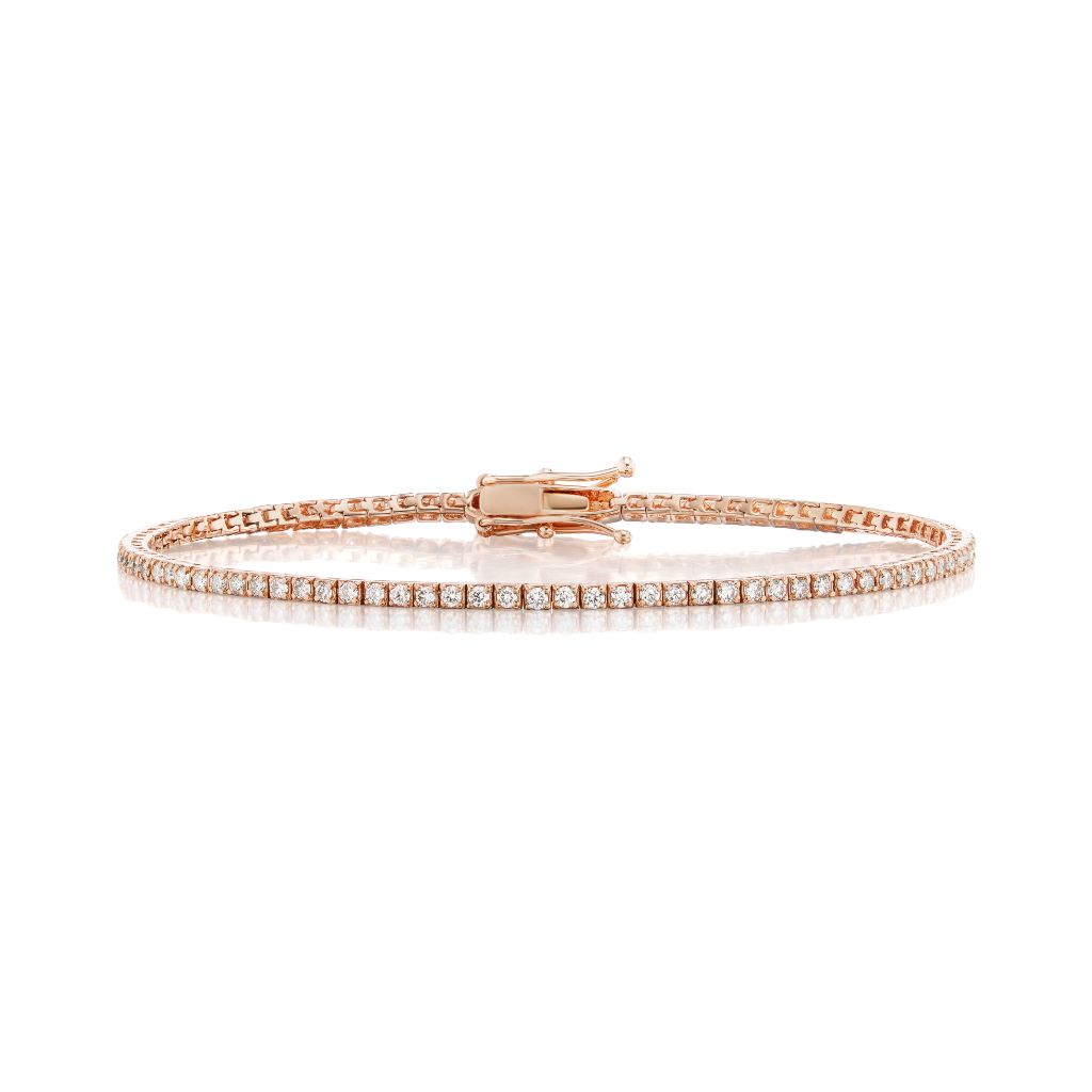 The Skinny Round Brilliant Diamond Tennis Bracelet features a single row of round brilliant diamonds in delicate rose gold, displayed on a white background.