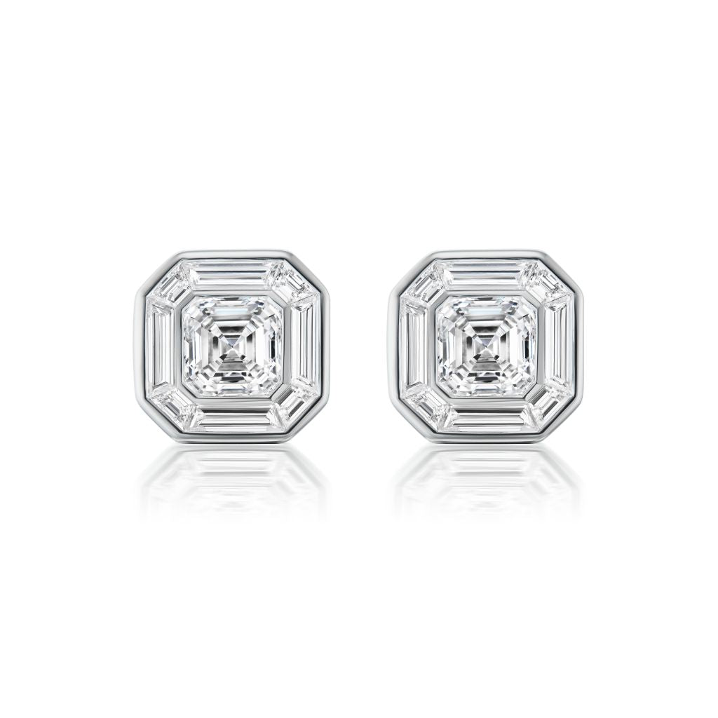 Mosaic Studs in White Gold feature Asscher cut diamonds with square, stepped edges, set in 18k white gold and displayed on a white background.