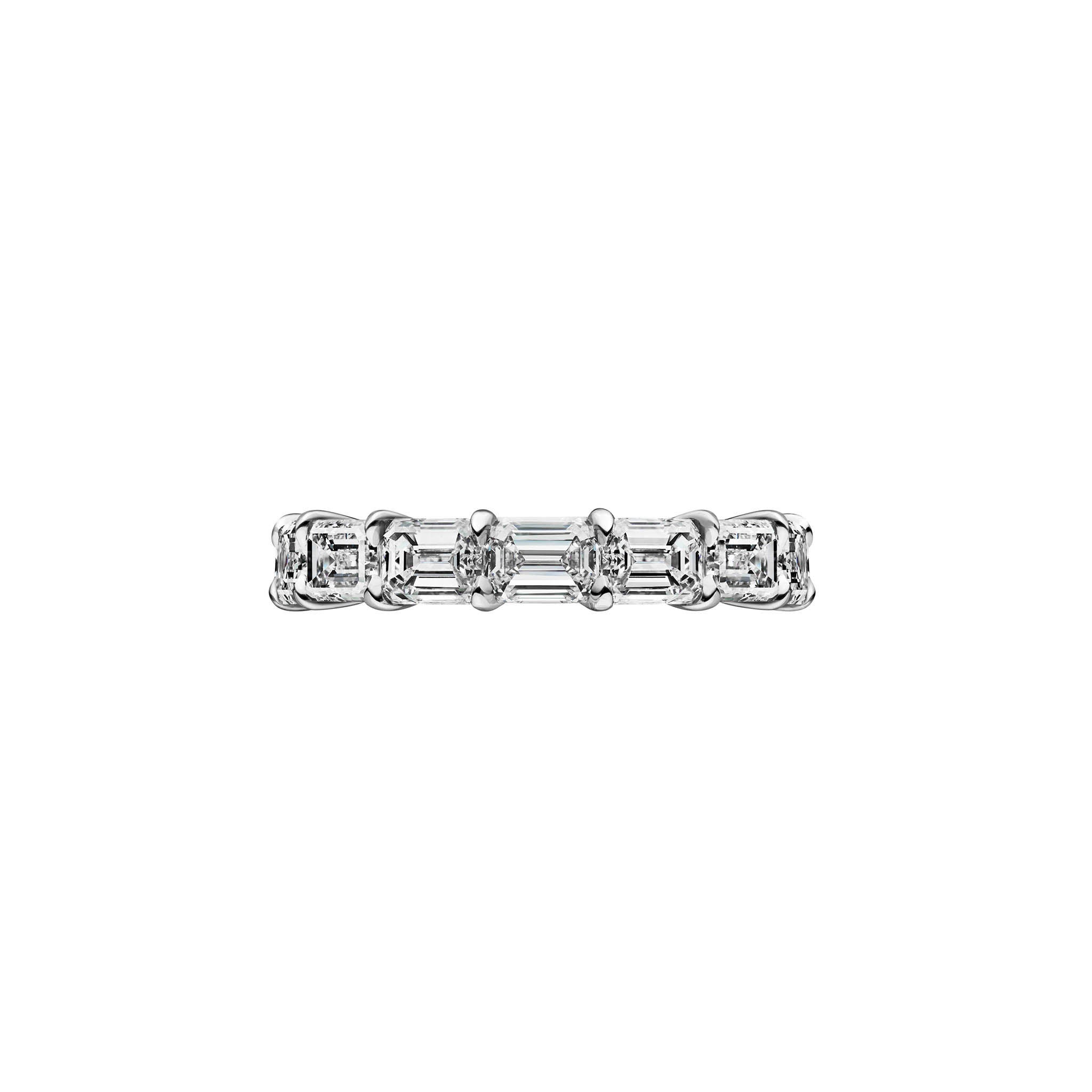 The East-West Emerald Cut Diamond Eternity Band features VVS1 clarity emerald-cut diamonds set in white gold or platinum, arranged in a continuous, repeating pattern around the ring.