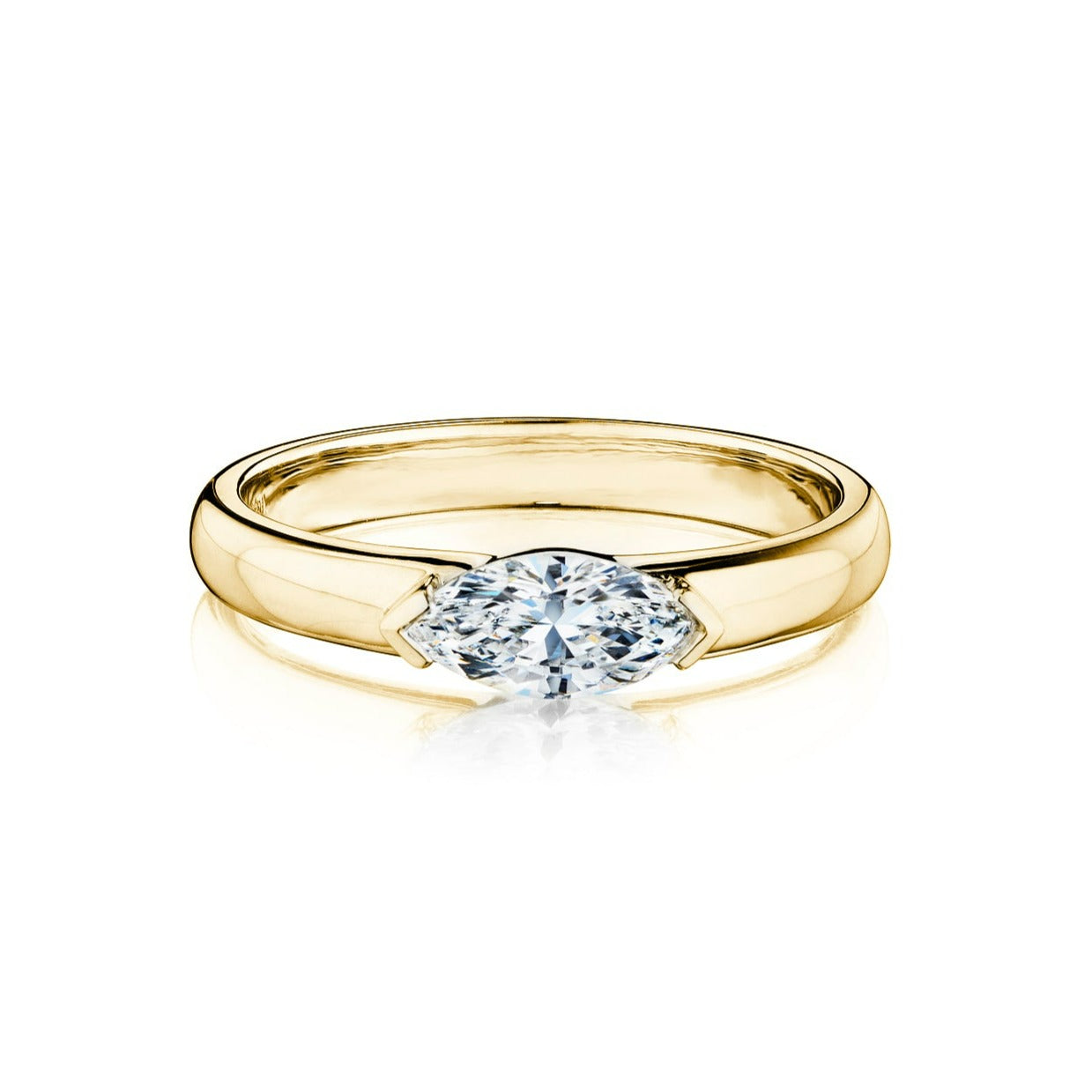 The East-West Marquise Diamond Solitaire Band showcases a horizontally set marquise diamond in an 18K yellow gold polished band, displayed against a white background.