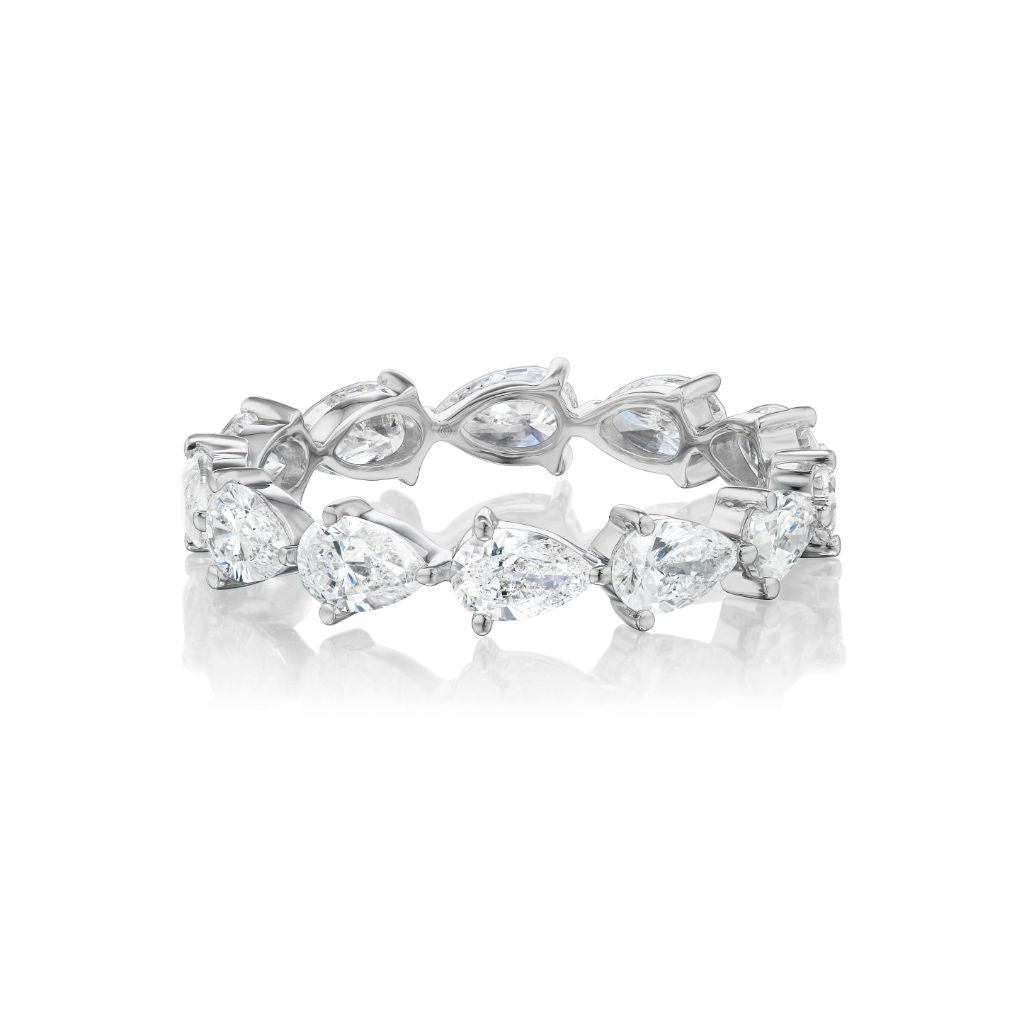 The Chasing Pears Eternity Band is a silver 18K ring with alternating marquise and pear-shaped diamonds in a seamless pattern, shown on a white background.