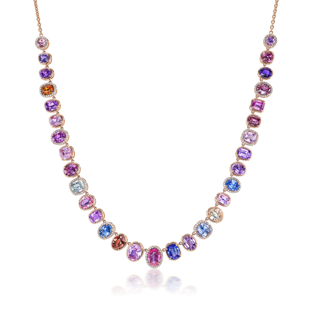 The Pavé Gumdrop Necklace in Rose Gold features mixed shape pink, blue, purple, and orange sapphires, each gem framed by pavé clear stones for a vibrant gradient effect. Crafted in 18K rose gold.