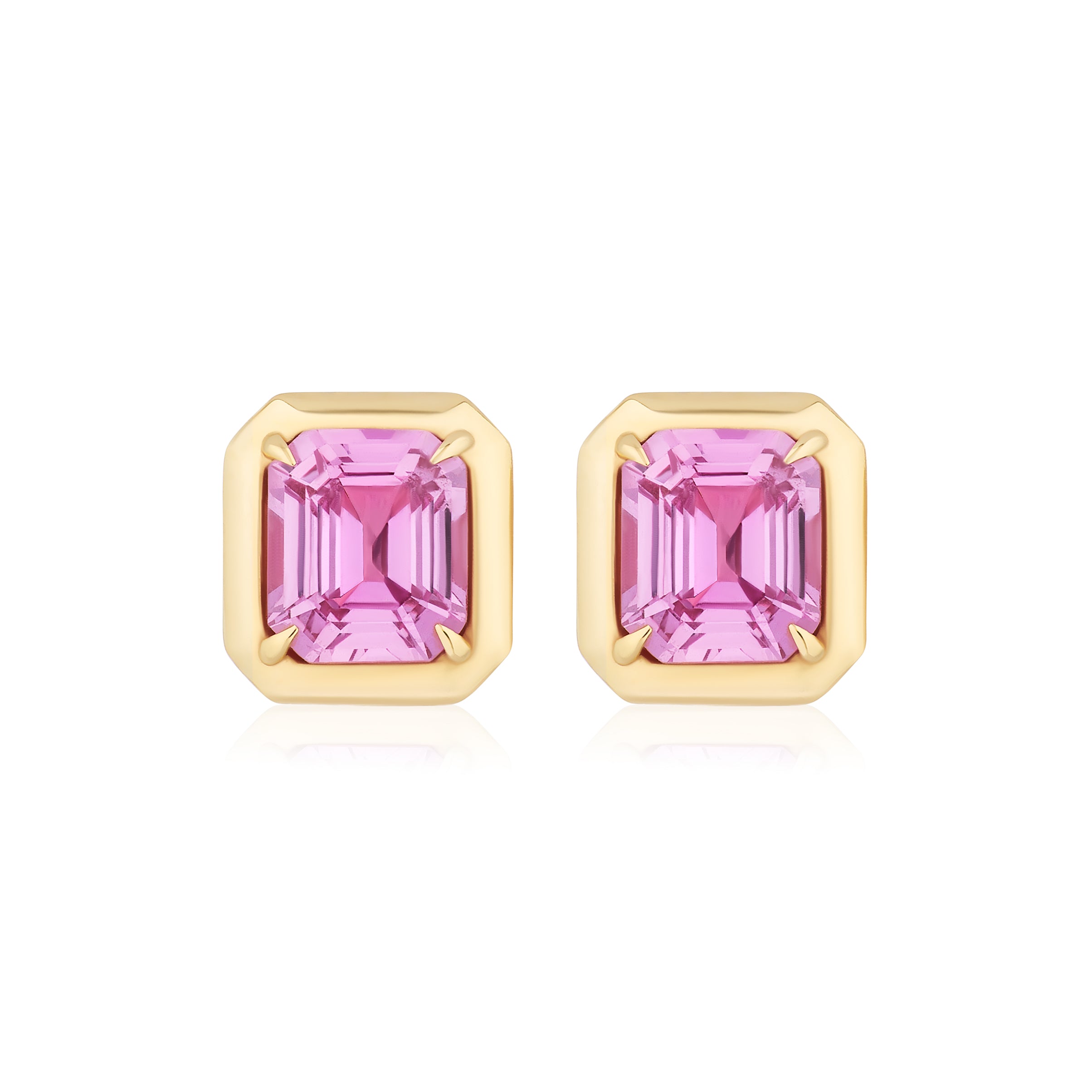 Asscher Cut Pink Sapphire Studs in Yellow Gold: A pair of bezel set asscher cut pink sapphires with four prongs in 18K yellow gold, shown on a white background.
