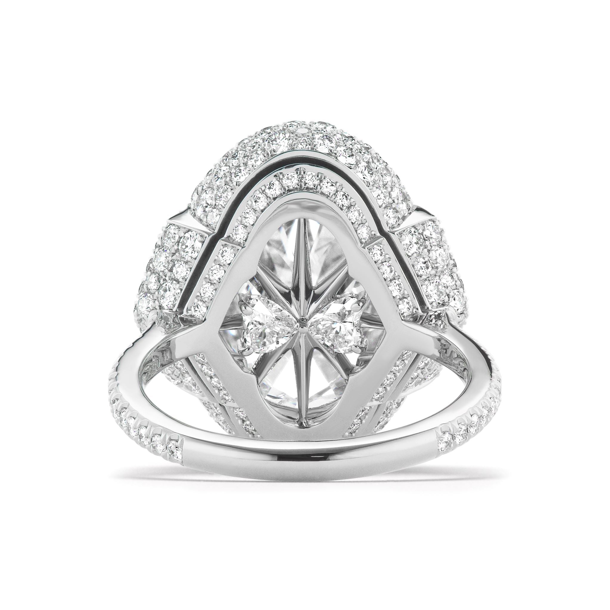 A close-up of the Cobblestone Pavé Basket Ring, showcasing its ornate design with a central oval diamond and epaulette diamond side stones, all set in a geometric arrangement of shimmering silver.