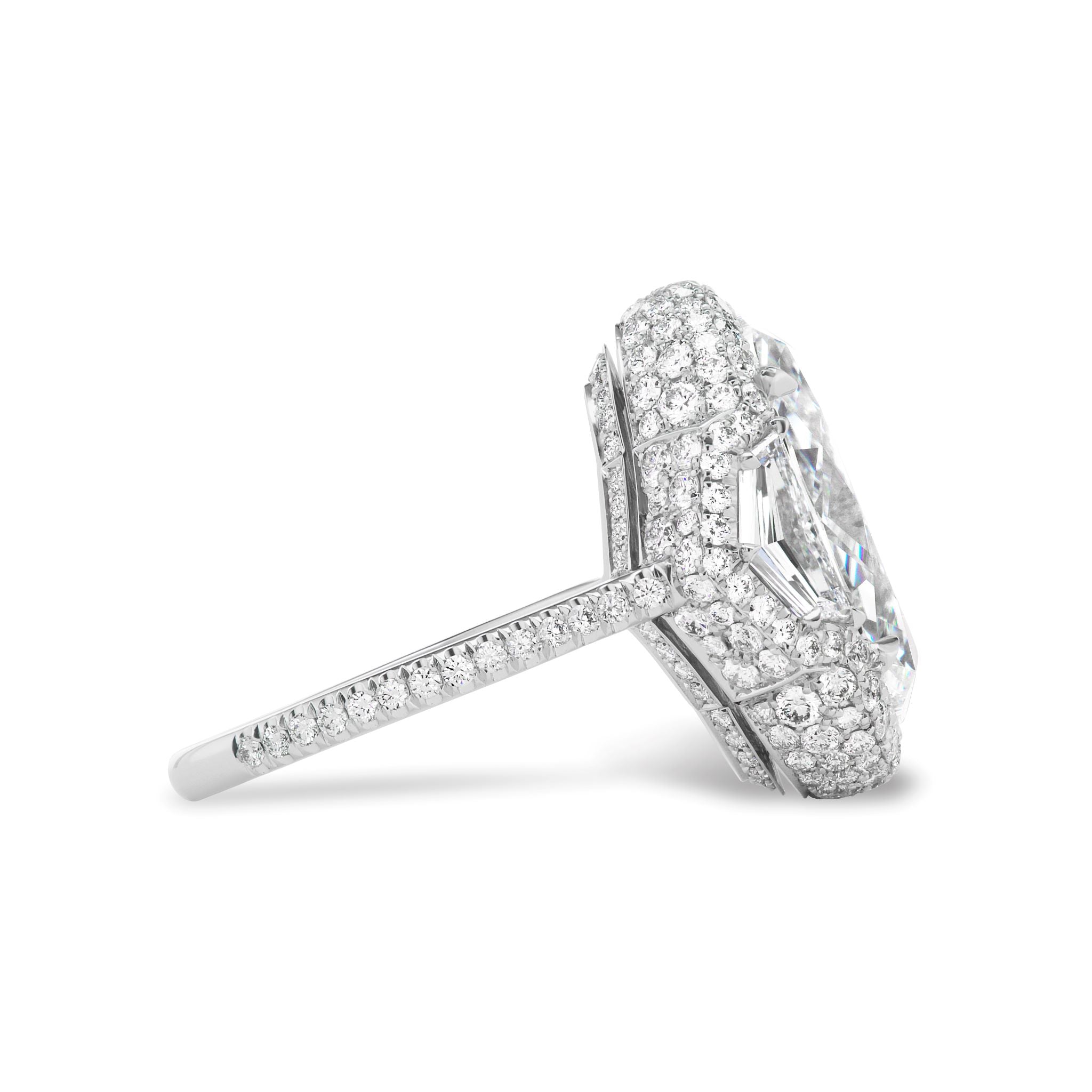 Side view of the Cobblestone Pavé Basket Ring, showcasing an oval diamond center flanked by epaulette side stones and pavé diamonds on a slim band—a stunning bridal choice.