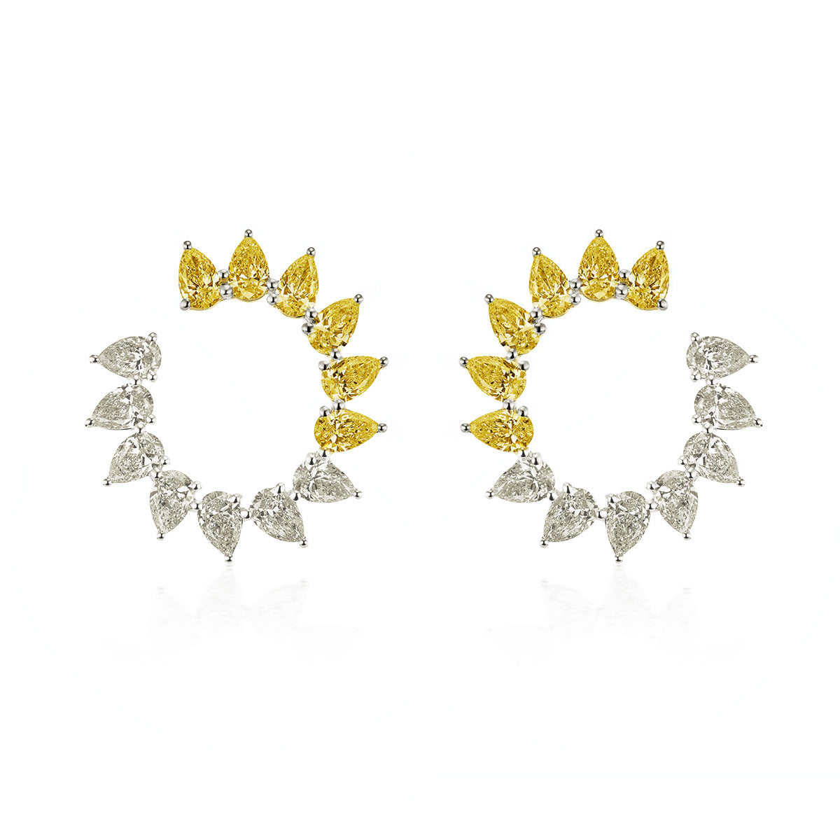 The This & That Sunshine Front-to-Back Hoops in white gold feature alternating fancy yellow and white pear diamonds (3.42tcw), with yellow stones at the top and white at the bottom for striking, symmetrical brilliance.