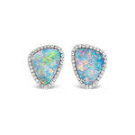 Opal Pavé Studs feature irregular triangular boulder opals set in white gold with a pavé diamond border, showcasing vibrant blue, green, and pink hues.