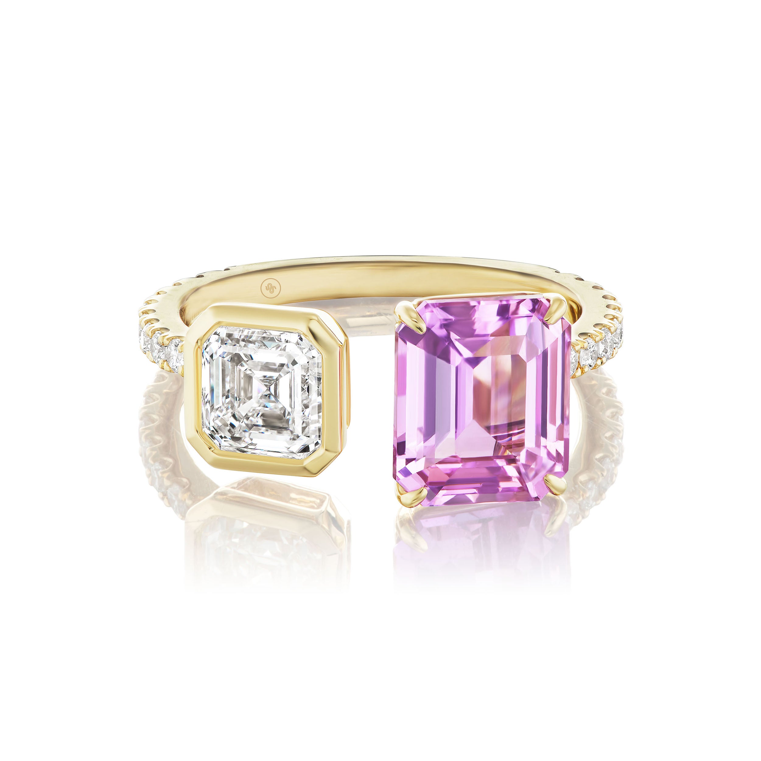 The Toi et Moi Pavé Ring features a square emerald cut diamond and a pink emerald cut sapphire side by side, set in 18K yellow gold with a pavé diamond band.