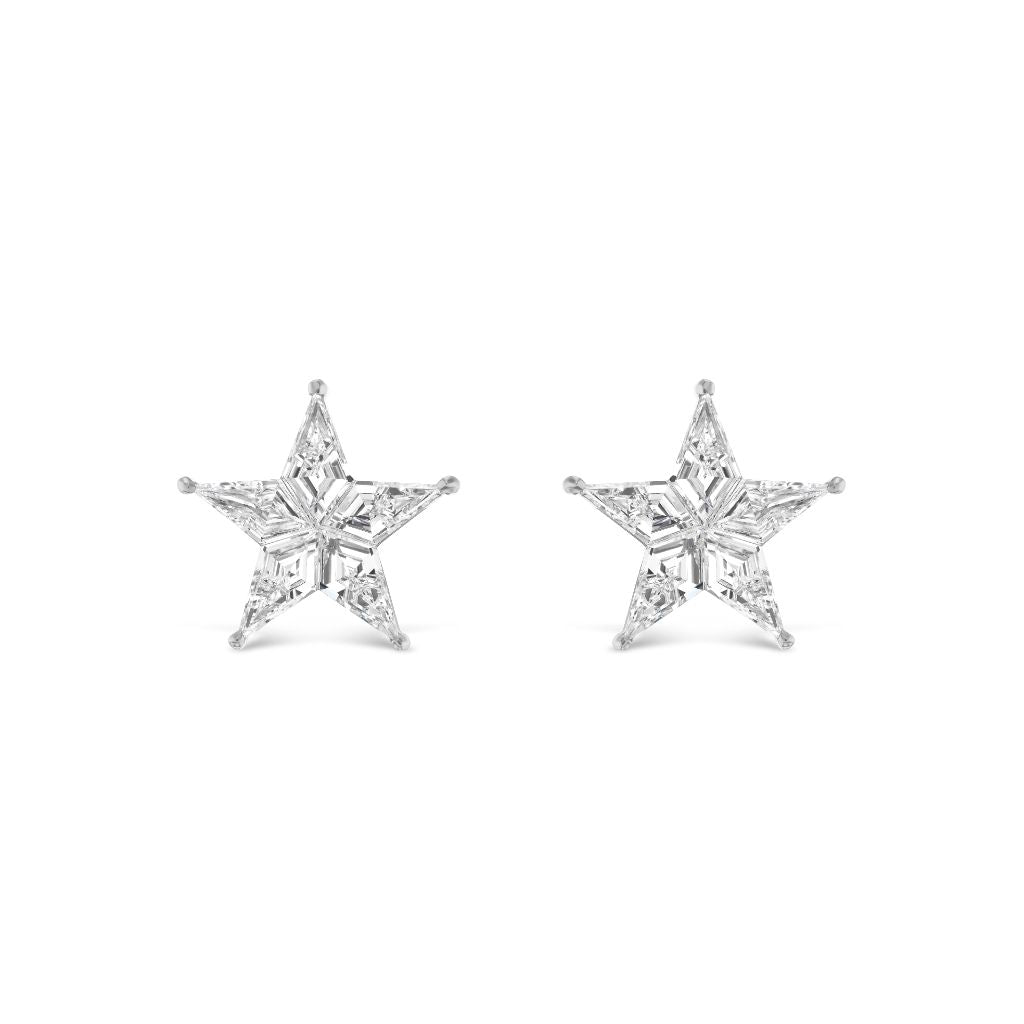 The Celestial Baby Star Studs in White Gold with Kite Diamonds feature five-point star-shaped studs, crafted from white gold and set with faceted kite diamonds for a subtle, sparkling touch to any outfit.