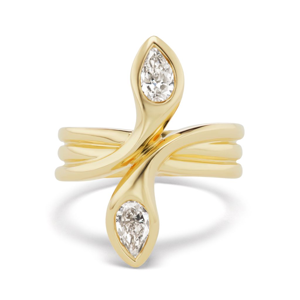 The Double Headed Serpent Ring with Pear Diamonds is crafted in 18k yellow gold, featuring a modern split-shank design and two pear-shaped diamonds set at each end opposite each other.