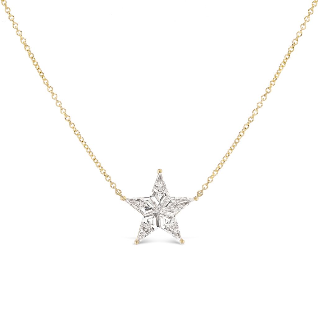 The Celestial Star Diamond Pendant in Yellow Gold features a sparkling diamond set on a delicate 18K gold chain, displayed against a plain white background.
